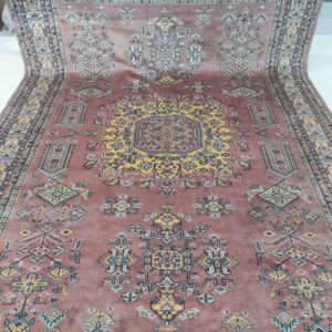 Handmade worsted wool and cotton area rug or runner with structured geometric Farsh-e-Nayle pattern displayed on floor