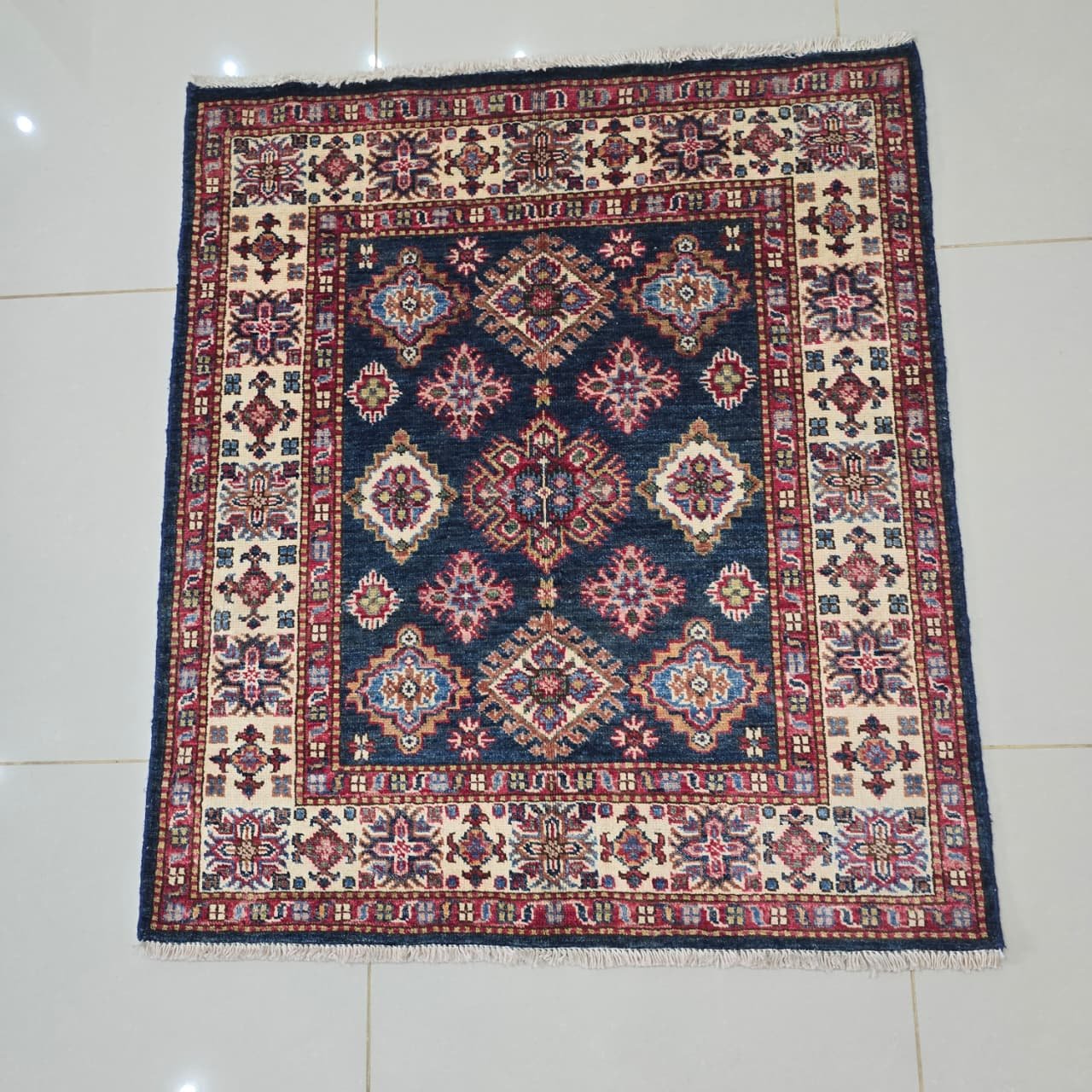 whatsapp image 2026 08 20 at 4.36.28 pm (2) Handmade wool and cotton area rug or runner with traditional geometric Kazak pattern displayed on floor