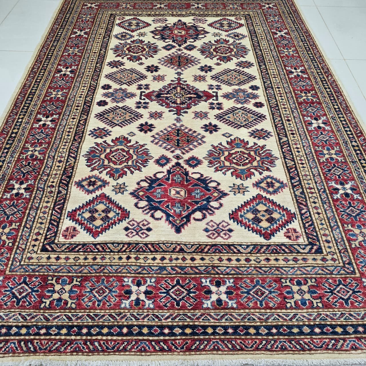 whatsapp image 2026 08 18 at 3.30.20 pm (2) Handmade wool and cotton area rug or runner with traditional geometric Kazak pattern displayed on floor