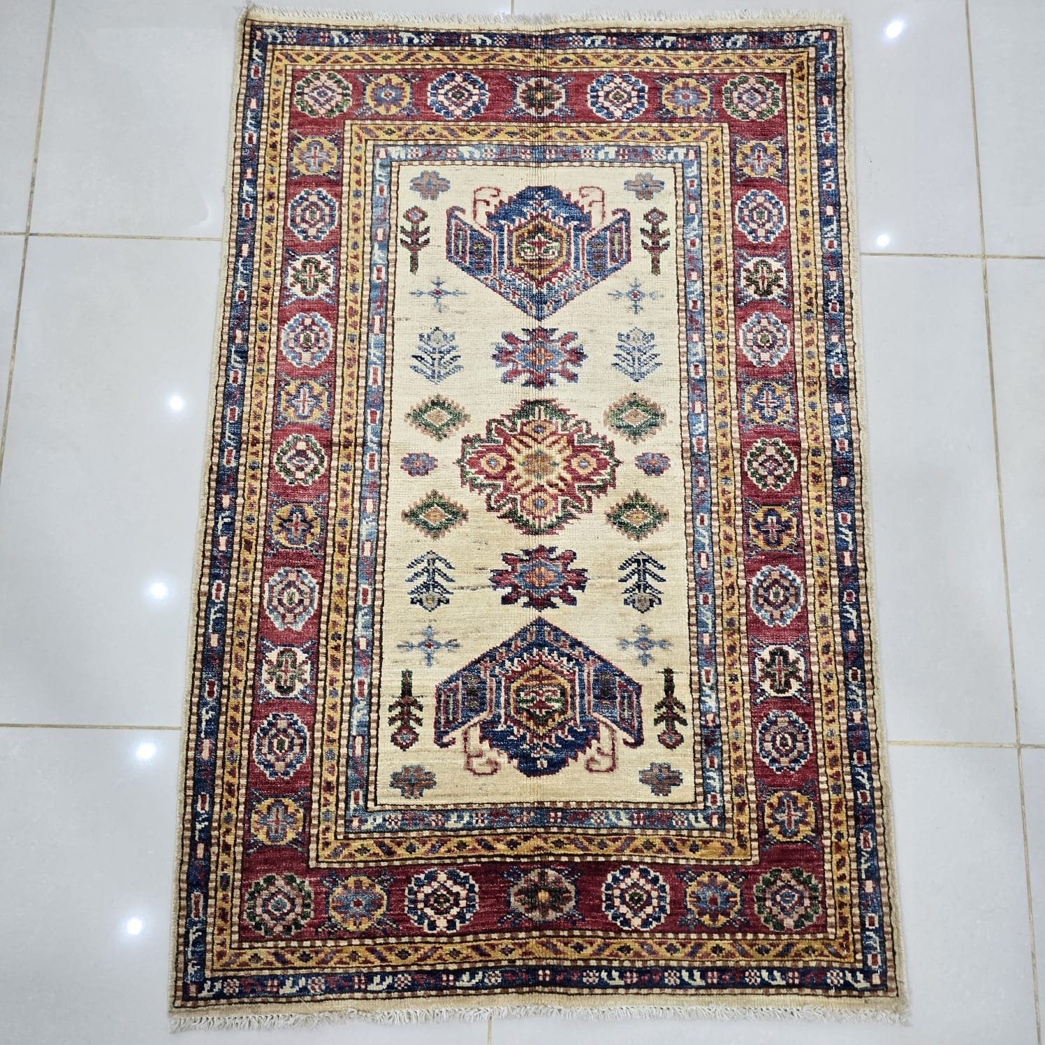 whatsapp image 2026 08 20 at 2.49.16 pm (2) Handmade wool and cotton area rug or runner with traditional geometric Kazak pattern displayed on floor