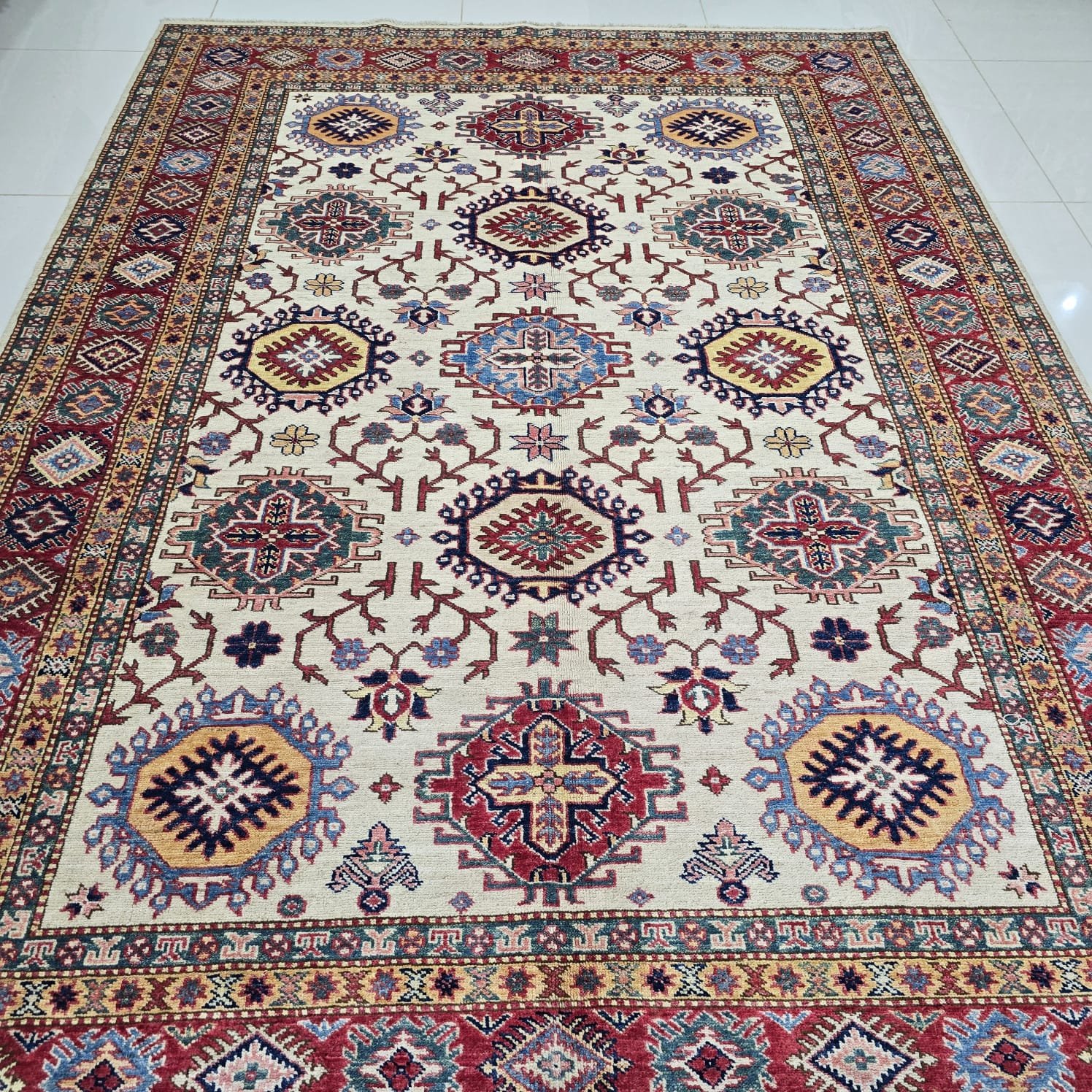 whatsapp image 2026 08 20 at 4.56.53 pm (2) Handmade wool and cotton area rug or runner with traditional geometric Kazak pattern displayed on floor
