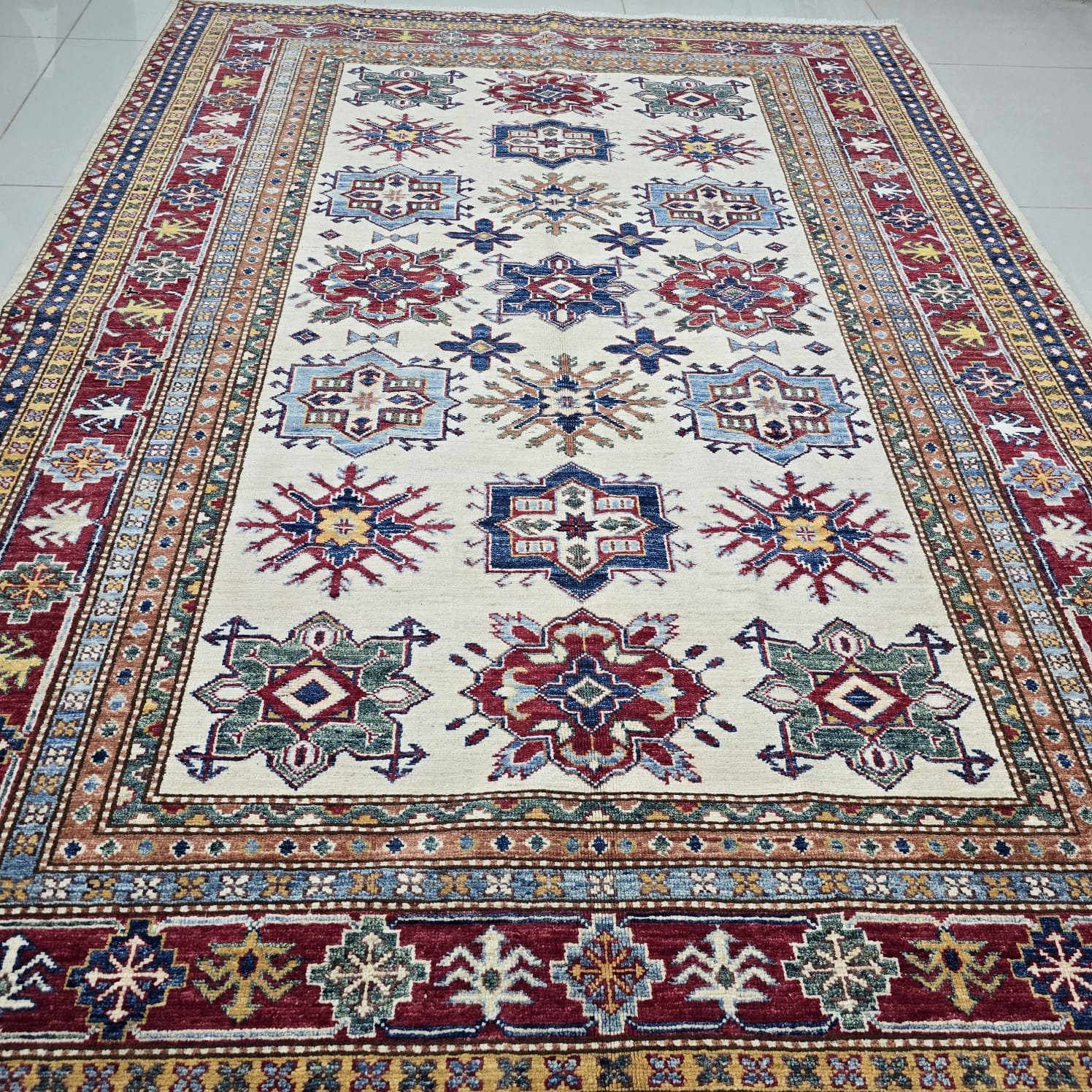 whatsapp image 2026 08 20 at 5.04.39 pm Handmade wool and cotton area rug or runner with traditional geometric Kazak pattern displayed on floor