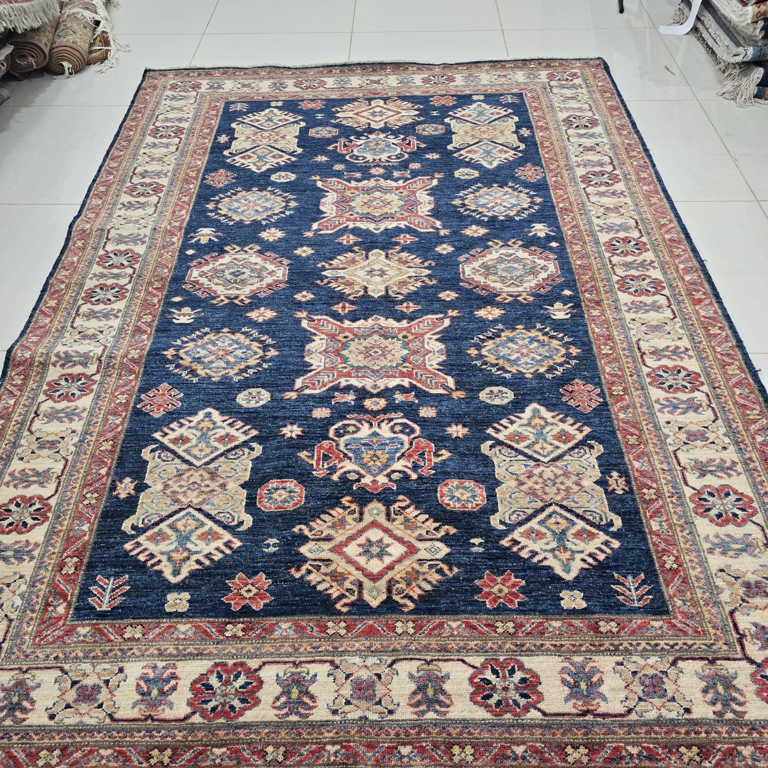 whatsapp image 2026 08 20 at 5.23.22 pm Handmade wool and cotton area rug or runner with traditional geometric Kazak pattern displayed on floor