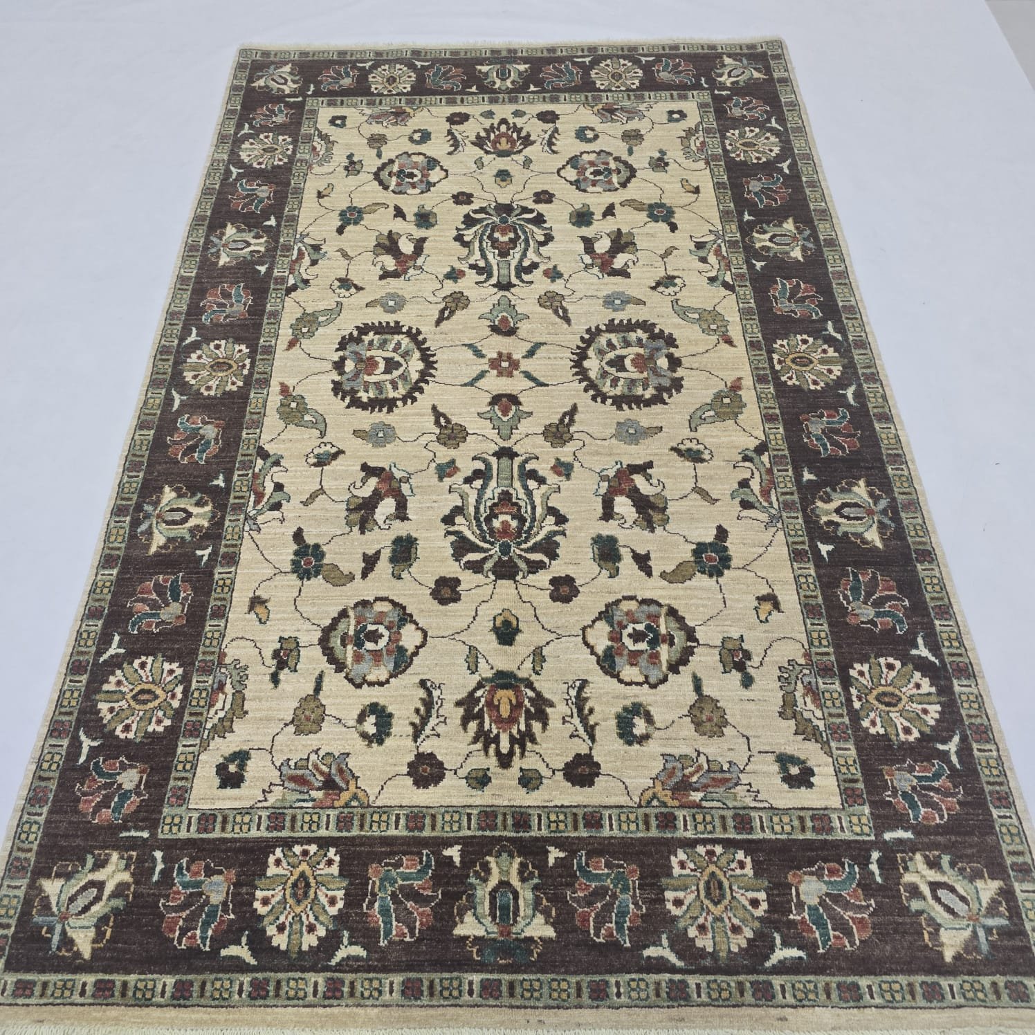whatsapp image 2026 09 15 at 5.57.59 pm (2) Handmade wool and cotton area rug or runner with classic floral Tribal pattern displayed on floor